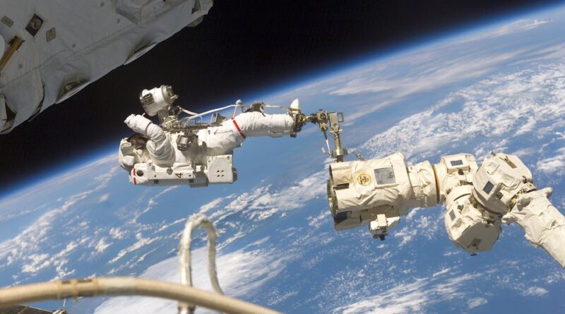Jerry Ross Secured by foot restraint on Spacewalk